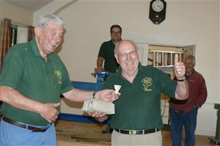 Bert presenting the winners prize to Pat Hughes for the speed turning competition